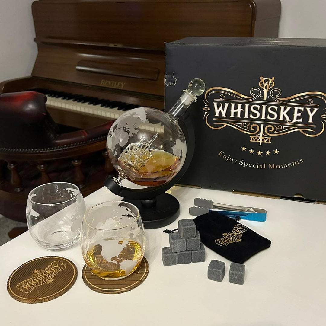 globe decanter explorer granite with whiskey and accessories on table