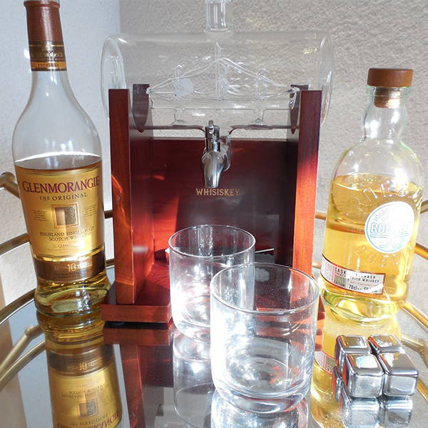 whiskey_decanter_with_sailing_ship_boat_whiskey_bottles_glasses_and_whiskey_stones