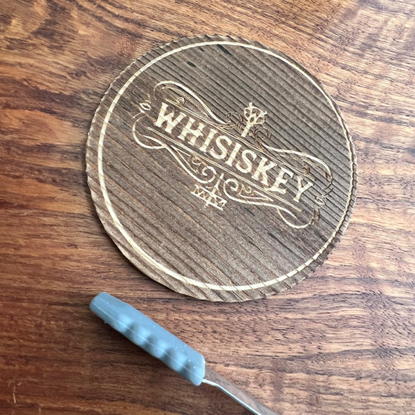 wooden_whisiskey_coaster_on_table
