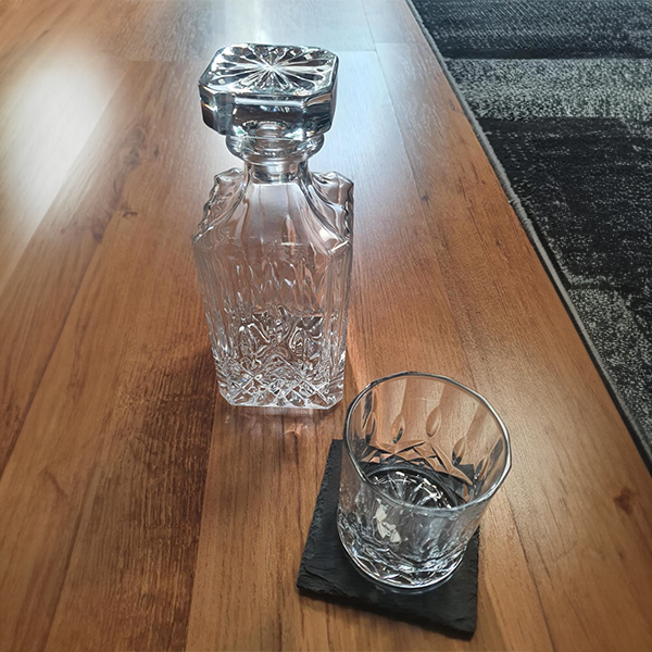 classic_decanter_with_glass_details_on_table_with_tumbler_and_slate_coaster