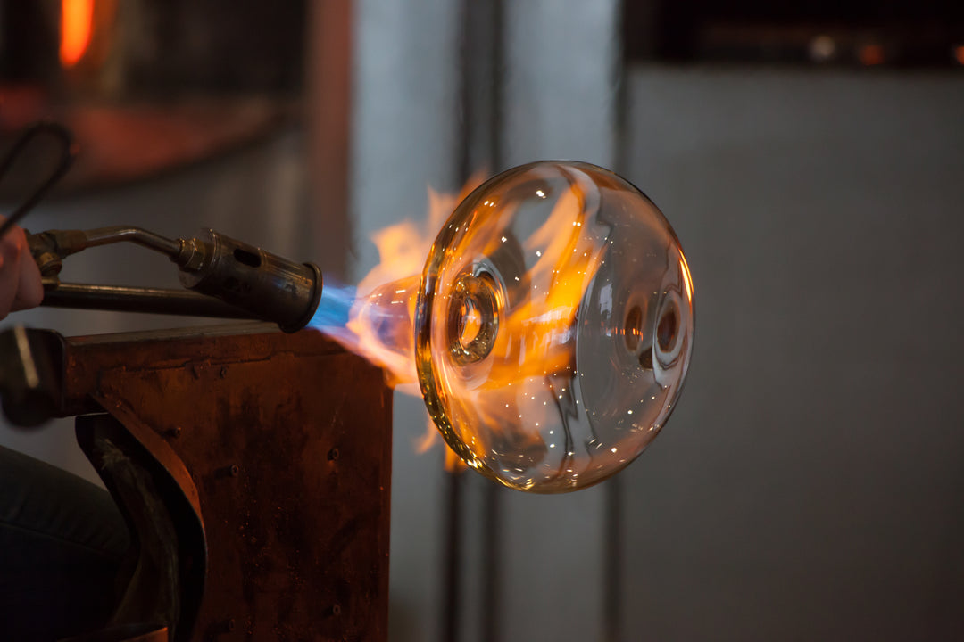 glass shaped into handmade decanter using fire 
