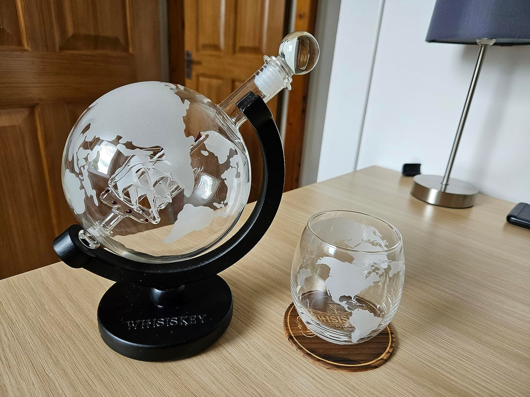 globe decanter on table with glass