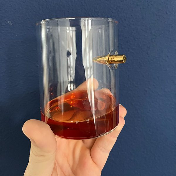 straight_bullet_glas_with_whiskey_and_bullet_inside
