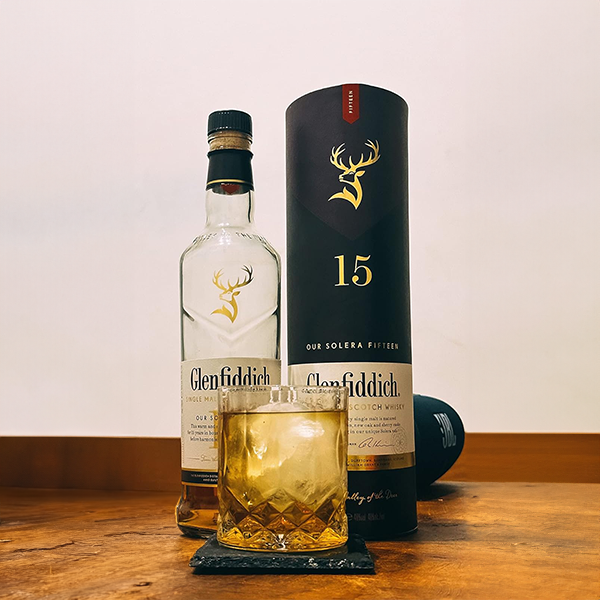 tumbler_with_glenfiddich_bottle_and_slate_coaster_on_table
